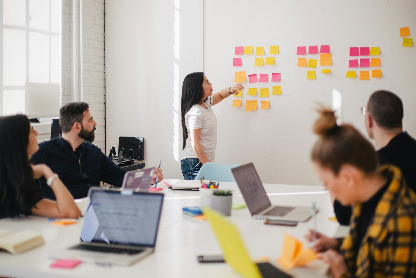 Strategists reviewing positioning notes during a client workshop